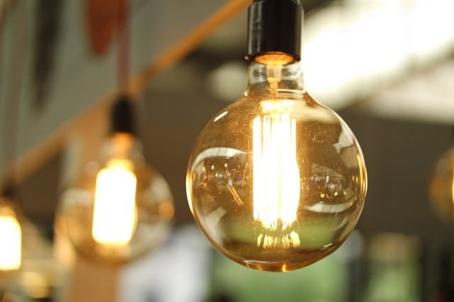 Large vintage Edison light bulbs representing energy efficiency.