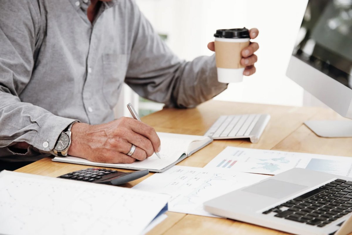 Accountant working with laptop and calculator