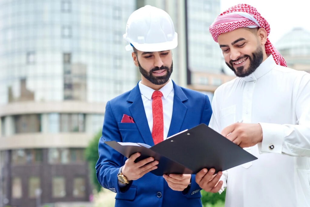 Man in traditional Arab attire smiling