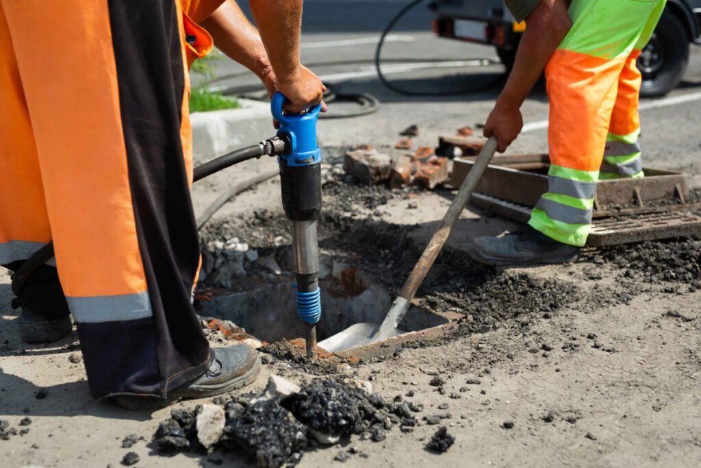 Road workers with jackhammer and shove