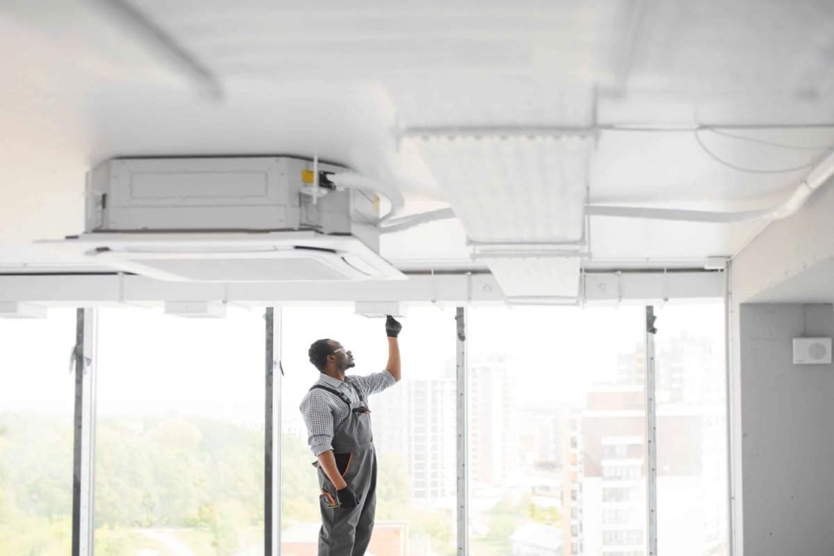 HVAC worker install ducted pipe system ventilation air conditioning