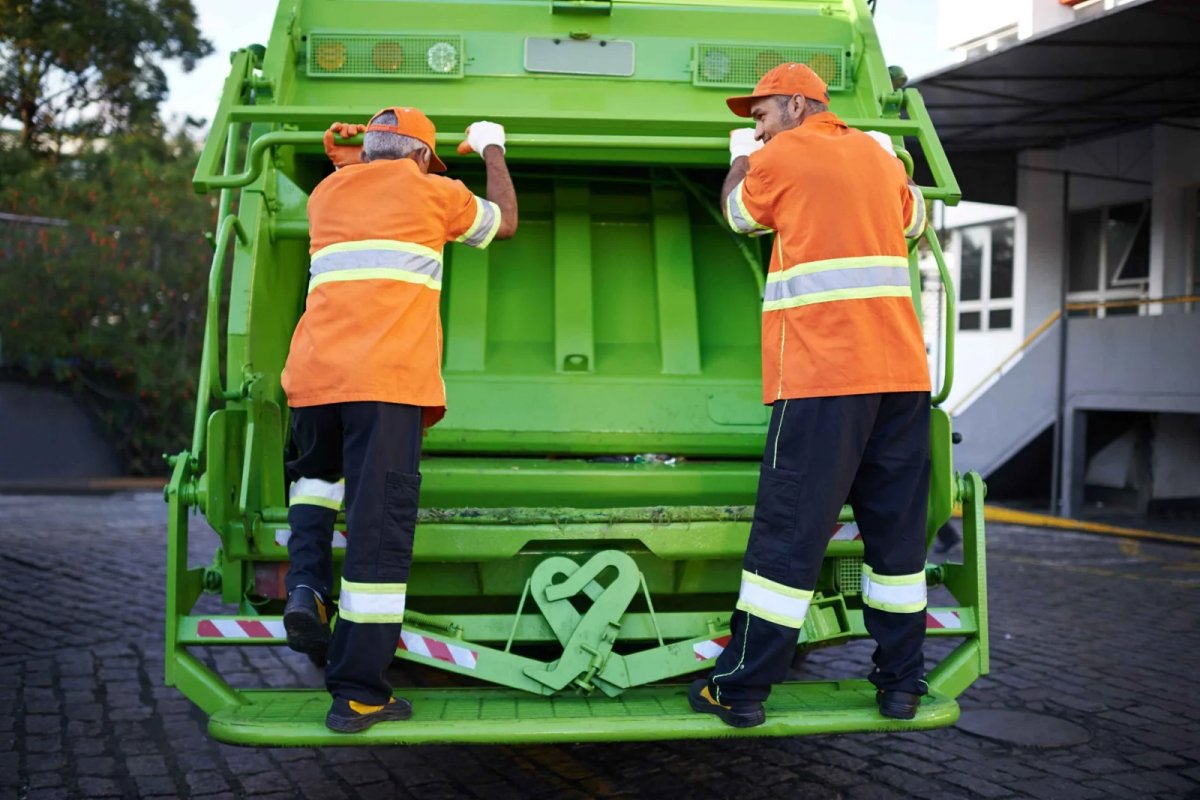 Waste Management Team Loading Waste on Truck