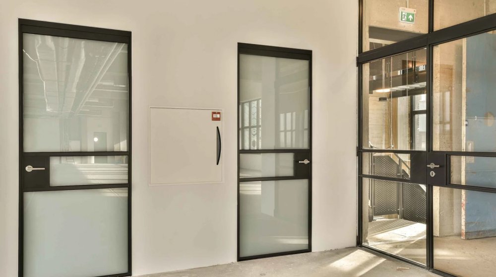 multiple lobby with glass doors white wall